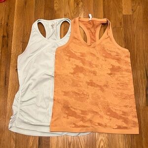 Two Athleta fastest track tanks.